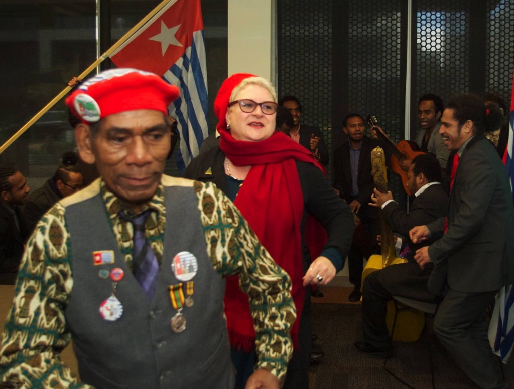 Doing the Yospan.  Black Orchid String Band, Terry Bukorpioper (Federal Republic of West Papua), Julie Bains (Greens Australia, Carlton Branch), Amos Wainggai (Office Manager) 