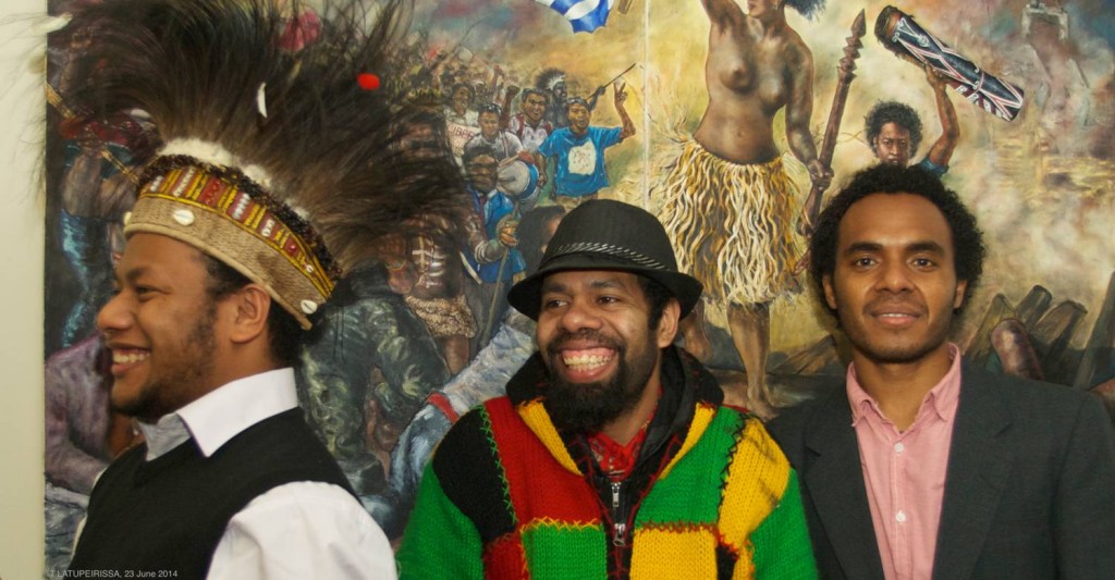 Melkias Okoka, Anton Rumbiak, Ucak Felle (DFAIT office staff) in front of 'Liberty Papua leading the People (after Delacroix)' by Peter Woods (2011). 